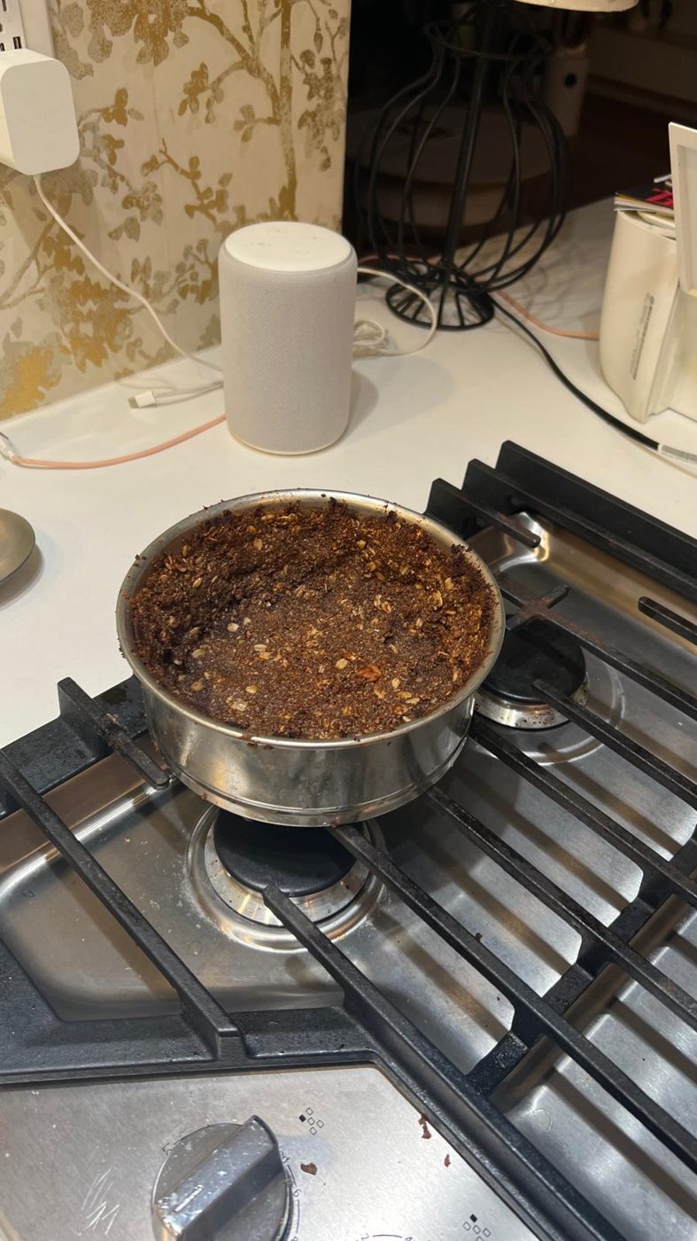 A moka pot on the stove — the coffee at the heart of the cake